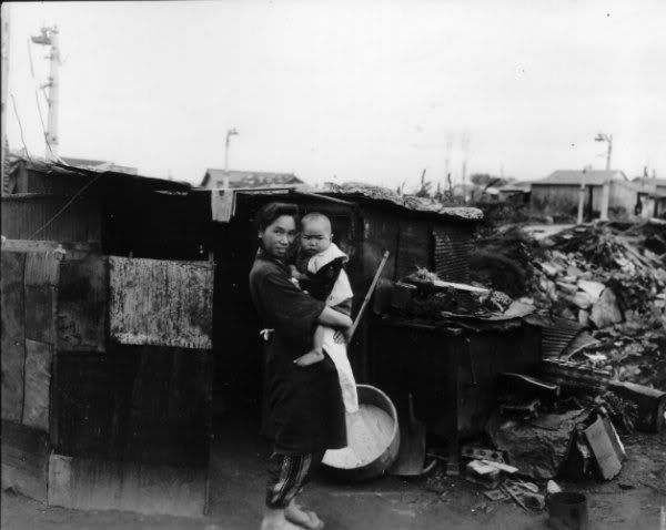 Ebisu-woman-and-child-outside-bombed-home-1.jpg