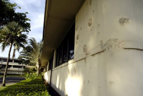 Bullet_holes_at_headquarters_bui-1.jpg