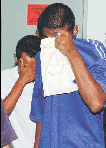 C. Bhagiaraj (right) and Mohd Fauzi Mohd Faizal pleaded guilty to eight counts of armed robbery.