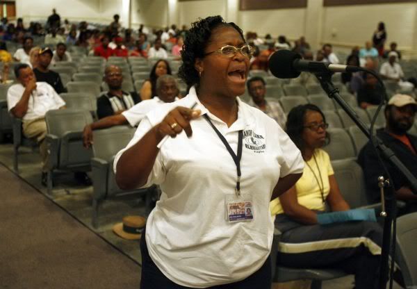 Manor Lake Elementary teacher and parent Lisa Chalmers tells her issues with Blue Ribbon during a town hall meeting.