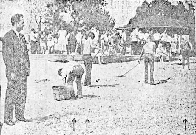 Youths being made to clean up the beach