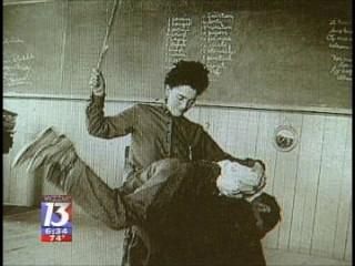 Old picture of teacher spanking student