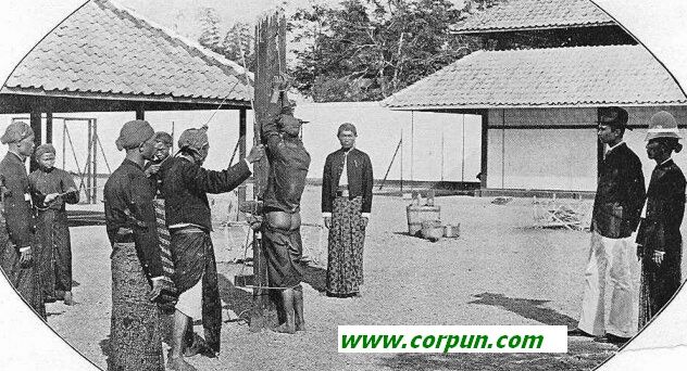 Indonesia: Caning in the prison, c.1900 - Click to enlarge