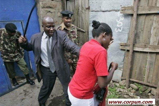 Police officer using sjambok - Click to enlarge