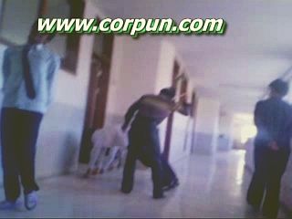 Schoolboy caning in corridor